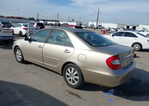 2003 Toyota Camry Xle z USA, uszkodzony, nr VIN JTDBE32K330176054